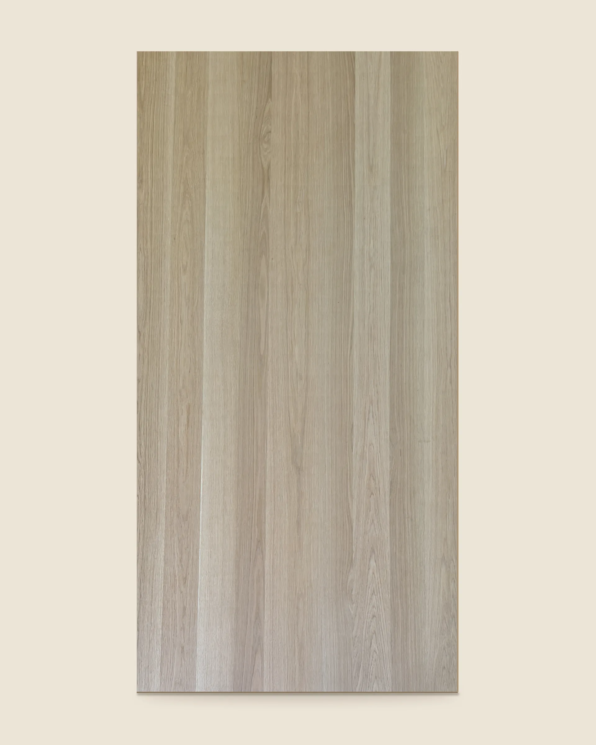 The shop's own panel in a random plank match: leaves of plainly different widths and tone, laid up in no repeating order.